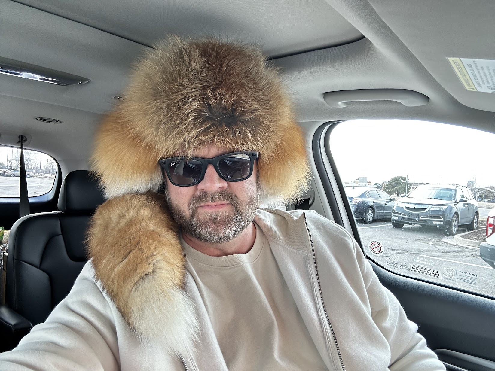 Alex wearing a fur hat on the road